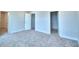 Carpeted bedroom with neutral walls, ensuite bathroom, and a walk-in closet, all designed for comfort and privacy at 1497 Leamington Ln, Winter Haven, FL 33884