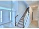 Bright entryway features a staircase, tiled flooring and a front door with sidelights for welcoming natural light at 1497 Leamington Ln, Winter Haven, FL 33884