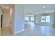 Open-concept living room features tile floors, recessed lighting, and lots of natural light at 1497 Leamington Ln, Winter Haven, FL 33884