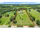 Wide aerial view shows property lines and outlines surrounding expansive acreage at 15195 Angus Rd, Polk City, FL 33868