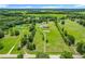 Sprawling acreage with a home, pond, and a long driveway creating a private setting at 15195 Angus Rd, Polk City, FL 33868