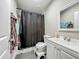 A bathroom with a bathtub, shower, and a dark shower curtain at 15195 Angus Rd, Polk City, FL 33868