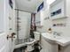 A charming bathroom with a unique shower curtain and toilet seat cover at 15195 Angus Rd, Polk City, FL 33868