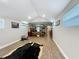 A spacious bedroom with wood-look flooring, a vaulted ceiling, and stylish decor at 15195 Angus Rd, Polk City, FL 33868