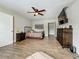 Bedroom featuring neutral decor, hardwood floors, and great light at 15195 Angus Rd, Polk City, FL 33868