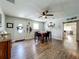 Cozy dining room with modern flooring, ceiling fan, and a view into kitchen at 15195 Angus Rd, Polk City, FL 33868