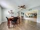 Inviting dining room featuring wood-look floors and an open view of other living spaces at 15195 Angus Rd, Polk City, FL 33868