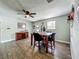 Casual dining room features stylish flooring, a ceiling fan, and a window for natural light at 15195 Angus Rd, Polk City, FL 33868