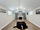 Spacious living room with a charming fireplace and stylish decor at 15195 Angus Rd, Polk City, FL 33868