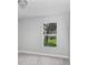 Cozy bedroom featuring natural light and wood-look vinyl flooring at 169 Birmingham Dr, Kissimmee, FL 34758