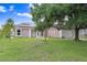Inviting single-story home with a manicured lawn and a charming walkway at 169 Birmingham Dr, Kissimmee, FL 34758