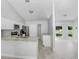 Modern kitchen with granite countertops, stainless steel appliances, and white cabinetry at 169 Birmingham Dr, Kissimmee, FL 34758