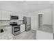 Stylish kitchen featuring granite countertops, stainless steel appliances, and ample storage at 169 Birmingham Dr, Kissimmee, FL 34758
