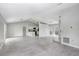 Bright living room with tile floors, vaulted ceilings, and an open concept design at 169 Birmingham Dr, Kissimmee, FL 34758