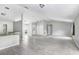 Bright, open floor plan with tile floors connecting the living room and kitchen at 169 Birmingham Dr, Kissimmee, FL 34758