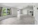 Spacious living room featuring tile floors, large windows, and an open layout at 169 Birmingham Dr, Kissimmee, FL 34758