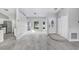 Spacious living room with tile floors leading to the kitchen and front entrance at 169 Birmingham Dr, Kissimmee, FL 34758