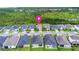 Aerial view of homes in a well-planned neighborhood with lush green spaces, marked with a location pin at 180 Azure Mist Way, Daytona Beach, FL 32124