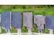Aerial view of the roof tops and driveway in a well-planned neighborhood at 180 Azure Mist Way, Daytona Beach, FL 32124