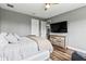Modern bedroom with hard flooring, TV and dresser at 180 Azure Mist Way, Daytona Beach, FL 32124