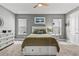 Bedroom featuring hard flooring, dresser and wall art at 180 Azure Mist Way, Daytona Beach, FL 32124