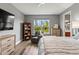 Bright bedroom with natural light, wood floors, and sitting area at 180 Azure Mist Way, Daytona Beach, FL 32124