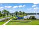 Community entrance sign with landscaping and lake views at 180 Azure Mist Way, Daytona Beach, FL 32124