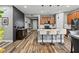 Contemporary kitchen with barstool seating, wood cabinets, and stainless appliances at 180 Azure Mist Way, Daytona Beach, FL 32124