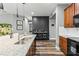 Updated kitchen with granite counters, eat-in breakfast bar and modern pendant lighting at 180 Azure Mist Way, Daytona Beach, FL 32124
