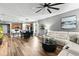 Open concept view into the kitchen, dining, and living space with hardwood floors at 180 Azure Mist Way, Daytona Beach, FL 32124