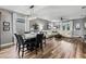 Open-concept living and dining area with hardwood floors and a contemporary chandelier at 180 Azure Mist Way, Daytona Beach, FL 32124