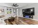 Cozy living room featuring a large TV and a contemporary electric fireplace at 180 Azure Mist Way, Daytona Beach, FL 32124