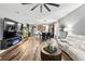 Expansive living space showcasing kitchen, dining, and seating areas with hard wood flooring at 180 Azure Mist Way, Daytona Beach, FL 32124