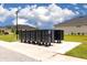 Community mailboxes in a well-maintained common area surrounded by lush green lawns at 180 Azure Mist Way, Daytona Beach, FL 32124