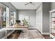 Sun-filled office features a spacious desk, large windows, closet, and neutral decor at 180 Azure Mist Way, Daytona Beach, FL 32124