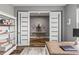 Office area with shelving flows to additional living spaces at 180 Azure Mist Way, Daytona Beach, FL 32124