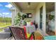 Relaxing screened-in patio with ceiling fan, plants, and comfortable seating at 180 Azure Mist Way, Daytona Beach, FL 32124