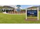 Community playground with modern equipment in Magenta Park, set against lush green lawns and mature trees at 180 Azure Mist Way, Daytona Beach, FL 32124