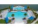 Aerial view of resort-style pool with in-water benches, cabanas, and palm trees at 180 Azure Mist Way, Daytona Beach, FL 32124