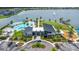 The Residents Club overlooks a large lake with luxurious pool and lounging area surrounded by lush landscaping at 180 Azure Mist Way, Daytona Beach, FL 32124