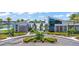 Beautiful Residents Club with palm trees, a manicured landscape, and modern architectural design at 180 Azure Mist Way, Daytona Beach, FL 32124