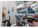 Organized storage room with shelves, cleaning supplies, and household items neatly arranged at 180 Azure Mist Way, Daytona Beach, FL 32124
