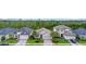 Beautifully landscaped street view featuring manicured lawns and various home styles in a well-kept neighborhood at 180 Azure Mist Way, Daytona Beach, FL 32124