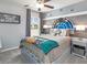 Themed bedroom features Star Wars decor and bedding, a ceiling fan, and ample natural light for a fun vibe at 1846 Daystar Dr, Haines City, FL 33844