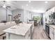 Spacious open concept living area with kitchen island, dining area, and living room at 1846 Daystar Dr, Haines City, FL 33844