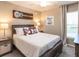 Cozy bedroom with a comfortable bed, stylish decor, and soft natural lighting at 1859 Daystar Dr, Haines City, FL 33844