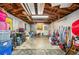 Unfinished basement with exposed wood beam ceiling, bare concrete floors, and concrete block walls at 213 Cannon St, Lakeland, FL 33803
