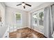 Comfortable bedroom with hardwood floors, natural light, and neutral tones at 213 Cannon St, Lakeland, FL 33803