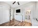 Bright bedroom with a dresser, closet, and an ensuite bathroom at 213 Cannon St, Lakeland, FL 33803