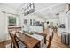 Bright dining room with view of the kitchen and living spaces, featuring a wooden table at 213 Cannon St, Lakeland, FL 33803
